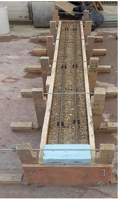 Figure 5 Preparation of the beams: a) beam ready for the casting of the layer b) reinforcement 