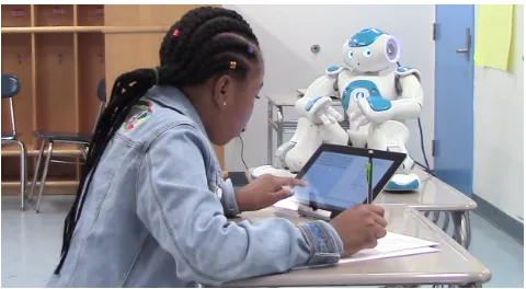 Figure 1: We studied the effects of the AT-POMDP policy onstudent learning in multiple tutoring sessions with a robot.