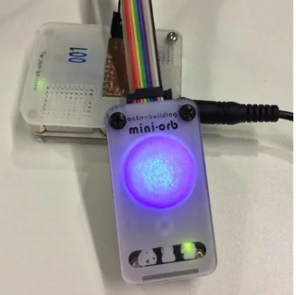 Fig. 1. MiniOrb sensor platform (background) and ambient interaction device (foreground) 