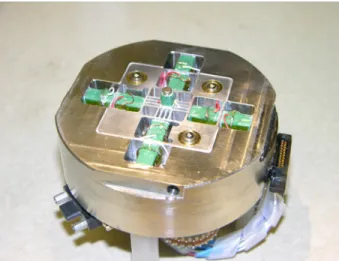 Fig. 2.  Photograph of the high-speed scanner. The center piece with  the comb-flexures and the two frames to stiffen the system in Z  direction can clearly be seen