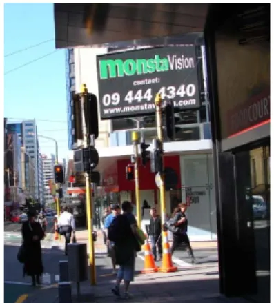 Figure 3.3 Large video/VMS signs  located at busy city intersection facing  oncoming traffic