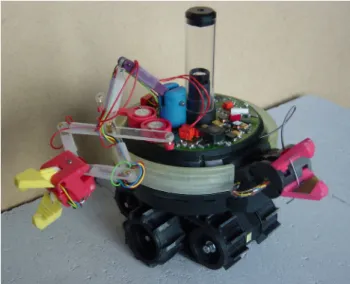 Fig. 1. One of the s-bot prototypes. The diameter of the main body is 116 mm. A SWARM-BOT is composed by a colony of approximately 30 s-bots.