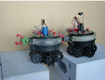 Fig. 2. Top and bottom view of the s-bot prototype. The bottom view shows the treels c drive mechanism rotating in respect to the main body.