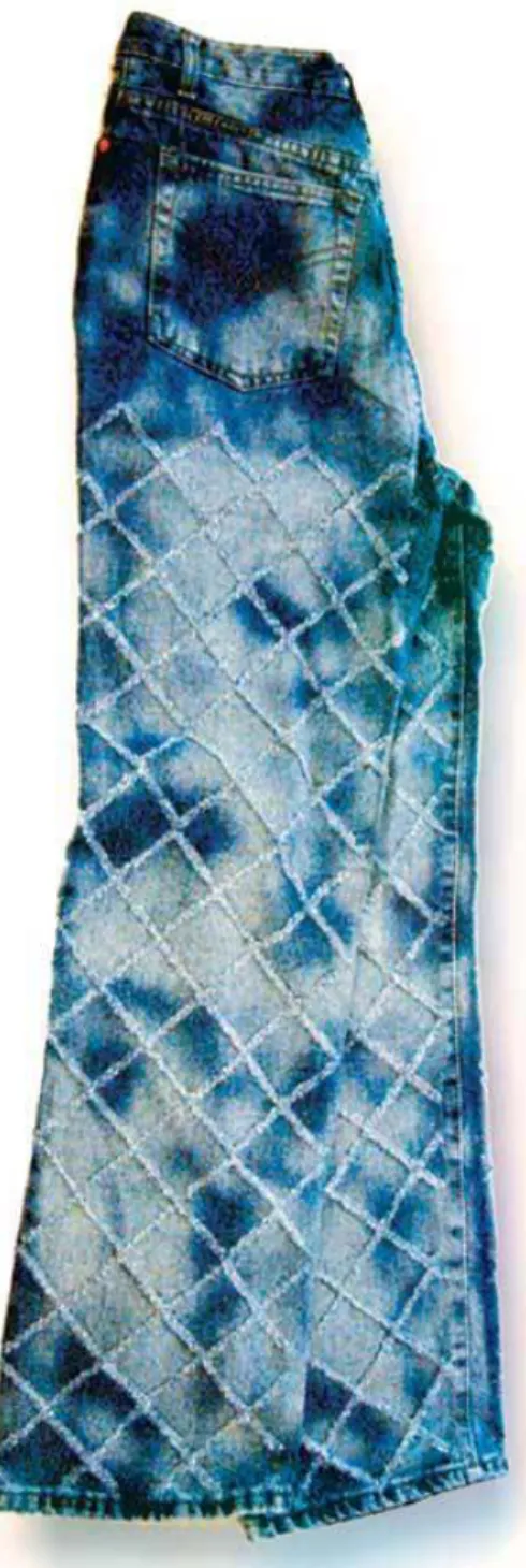 FIGURE 3. The laser tool can be used to  create two effects simultaneously, as in this  pair of custom denims, which have an acid  wash and checkered “embossed” look