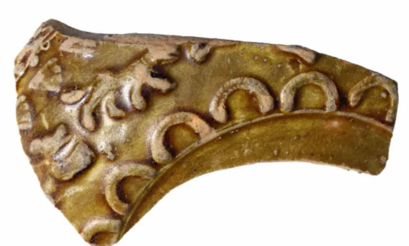 Fig. 11: Lead votive object depicting the god  Silvanus from the vicinity of the refuse pit  (photograph: P