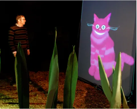 Fig. 7. A visitor talks to the Cheshire Cat. See Color Plate 6.  