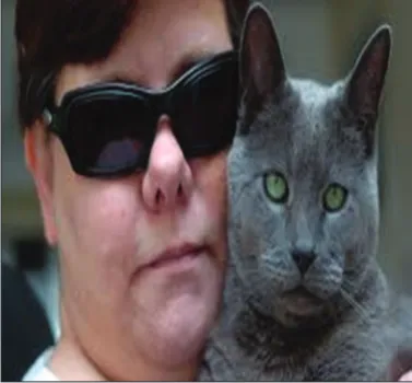 Fig. 8: Guide cat helping its visually blind owner