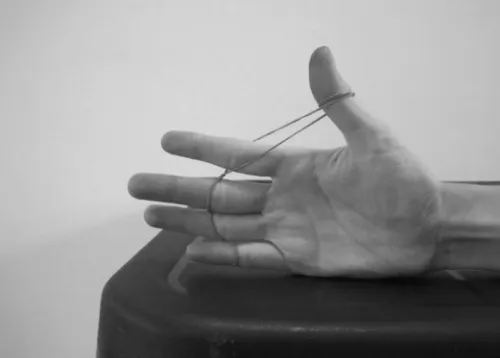Figure 2 A–C The eccentric training protocol. (A) The patient starts with the unweighted hand in the hammer curl position