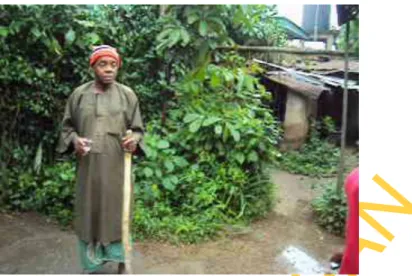Fig. 2. An Okuidem about to perform his routine libation, consisting praise, prayer, invocation  and supplication to the deities/goddesses, dressed in his normal Ibibio traditional attire