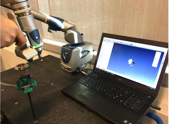 Figure 3-3 Inspection of an FDM part with Faro Laser Arm. 